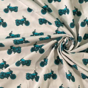 Jersey fabric printed with turquoise motorbikes on white background.